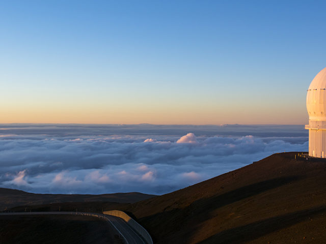 Why is large-scale neutrino observatory in Pacific ocean?